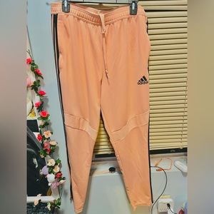 Women’s coral adidas track pants